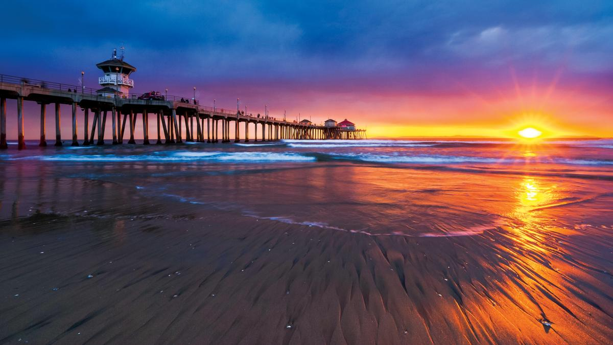 Sunset over a pier at the Opiniion Resident Experience Summit 2026 venue - Opiniion: Resident Insight that Drives Property Success