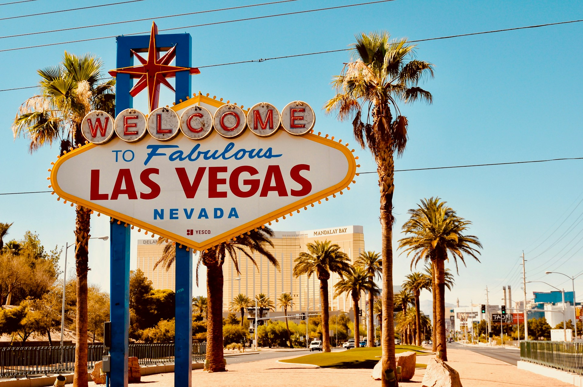 Las Vegas welcome sign on a sunny day with palm trees - Opiniion: Resident Insight that Drives Property Success