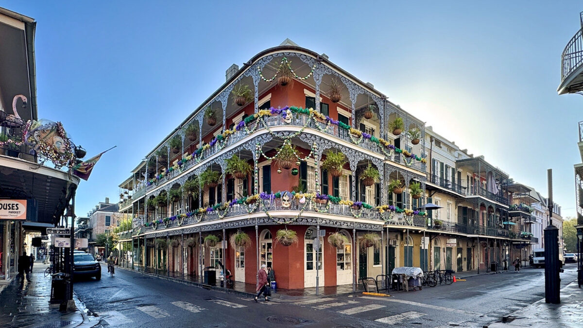Ornate building with decorated balconies in a vibrant urban setting - Opiniion: Resident Insight that Drives Property Success