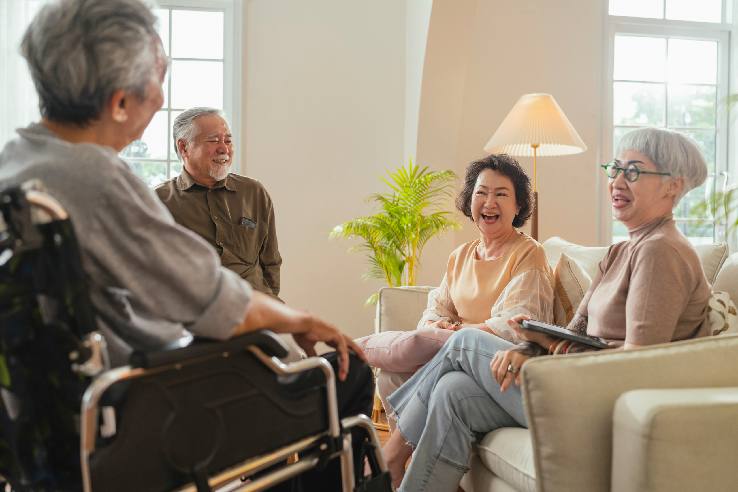 Seniors socializing in a living room at Chelsea Senior Living - Opiniion: Resident Insight that Drives Property Success