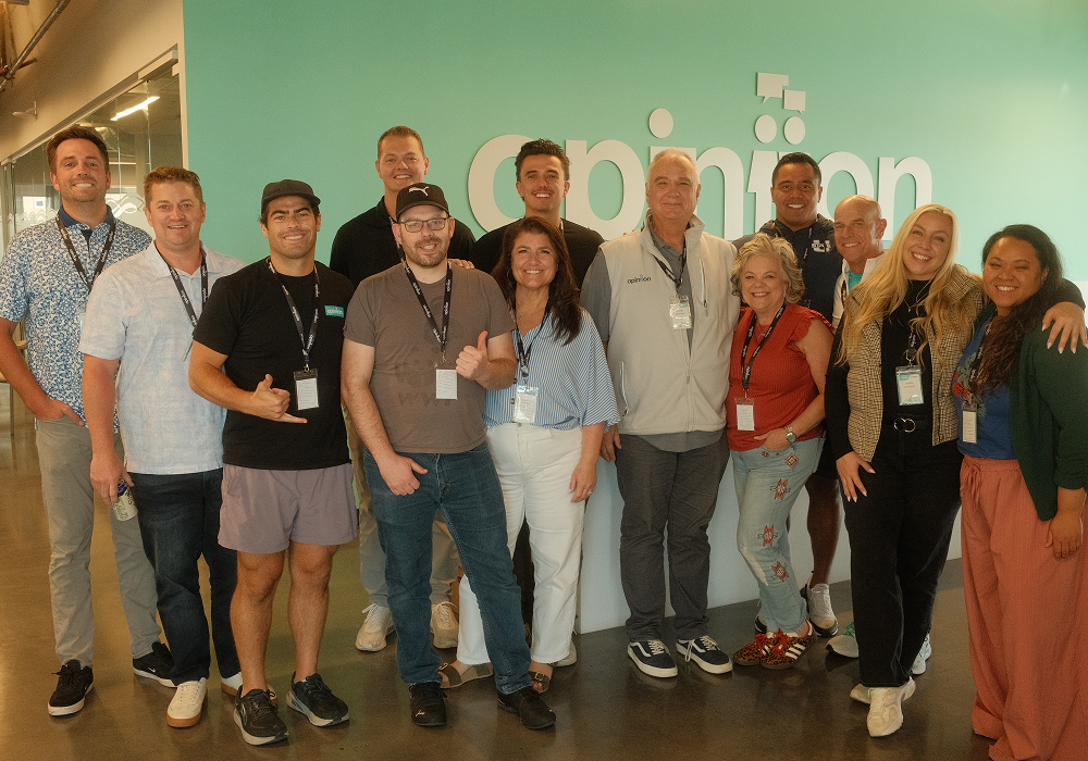 Team Celebration – Opiniion: Resident Insight that Drives Property Success Team of professionals in multifamily reputation management smiling together - Opiniion: Resident Insight that Drives Property Success